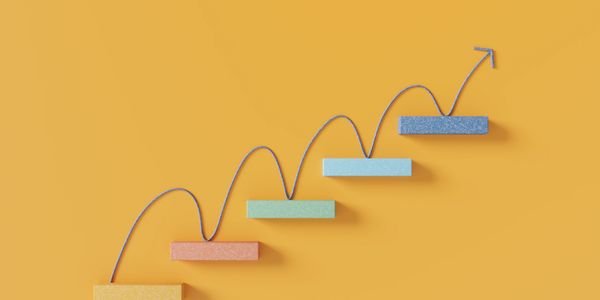 Floating shelves going upwards in a diagonal pattern with an arrow touching bouncing off each step. 