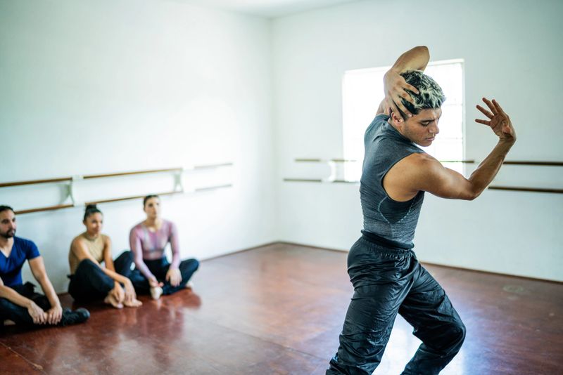 Young man dancing at dance studio