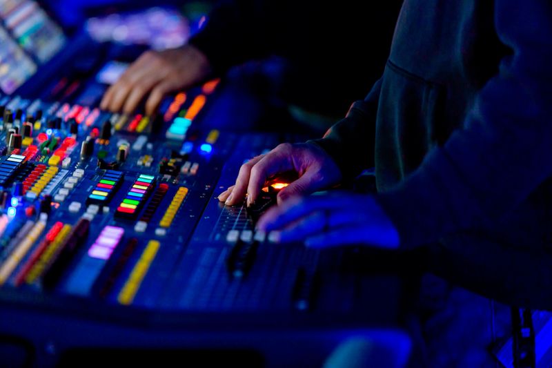 Sound engineer mixing live at night