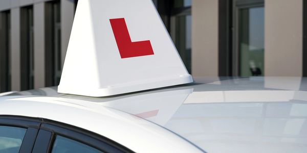 Driving school training car with dual controls and L plates
