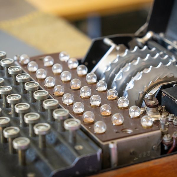 Close-up of vintage encryption machine keys and dials.