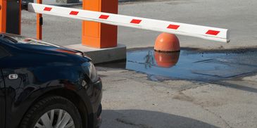 a car waiting to park in secure parking lot