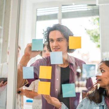 Person in business attire using a tablet device.