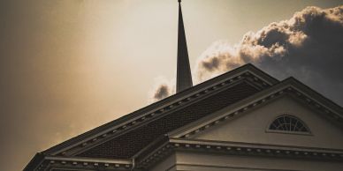 Church steeple against a dramatic sky.