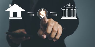 Person interacting with virtual icons of home, money, and banking.