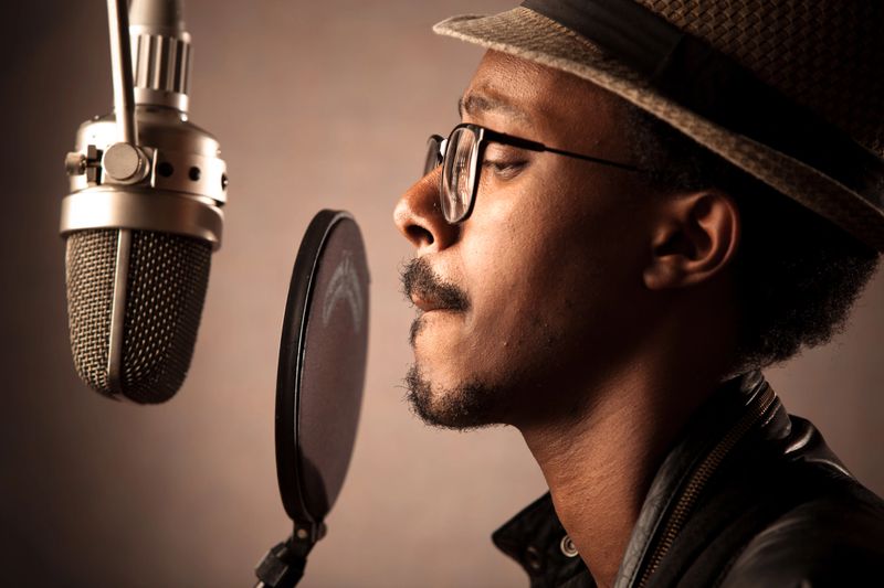 African-American recording artist recording an album in the studio