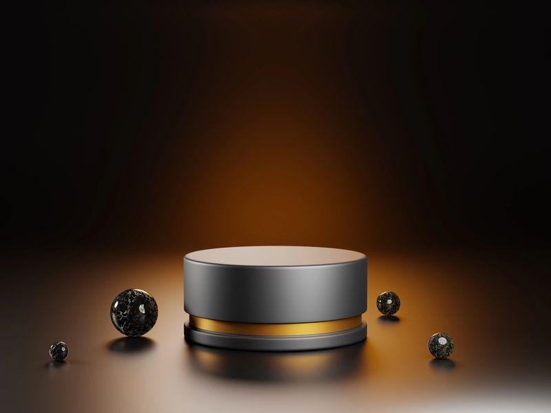 3d render luxury black pedestal or stand podium with golden frame and marble stone spheres for display product. Mock up empty cylinder stage, platform with balls on dark background. 3D illustration