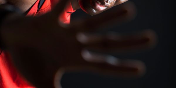 Person extending a hand toward the camera.