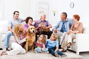 Family enjoying time together with their dog in the living room.