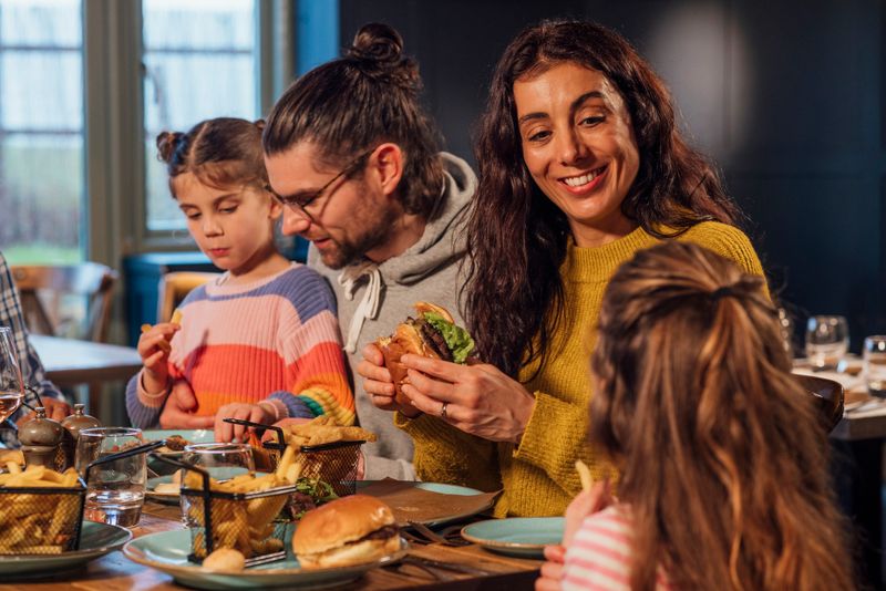 A family of four, parents and their two daughters, shared laughter and burgers at a lively restaurant, filling the moment with joy and cherished memories.
There is video to match this scenario.
