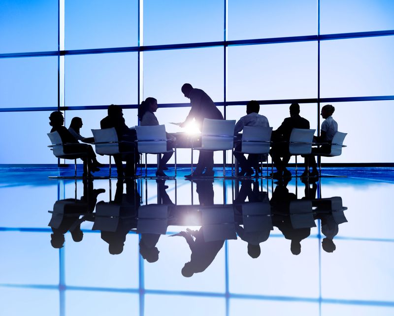 Business meeting in  office with large windows