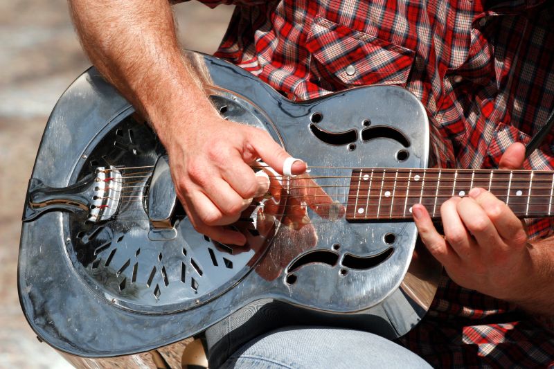 Anthony Douglas performing live with a steel guitar.
