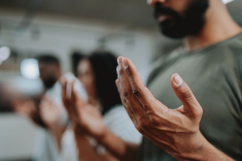 Group of people praying for mental support