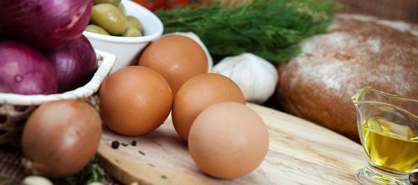 Fresh ingredients on a kitchen counter ready for cooking.