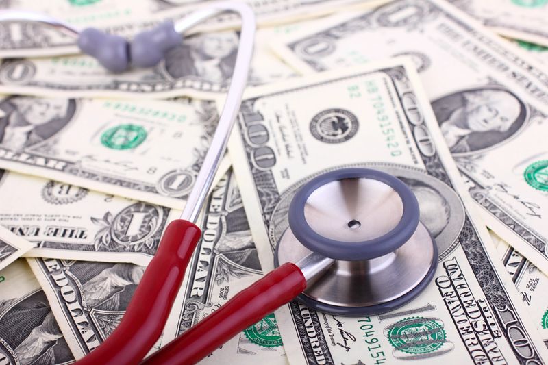 Stethoscope on dollars