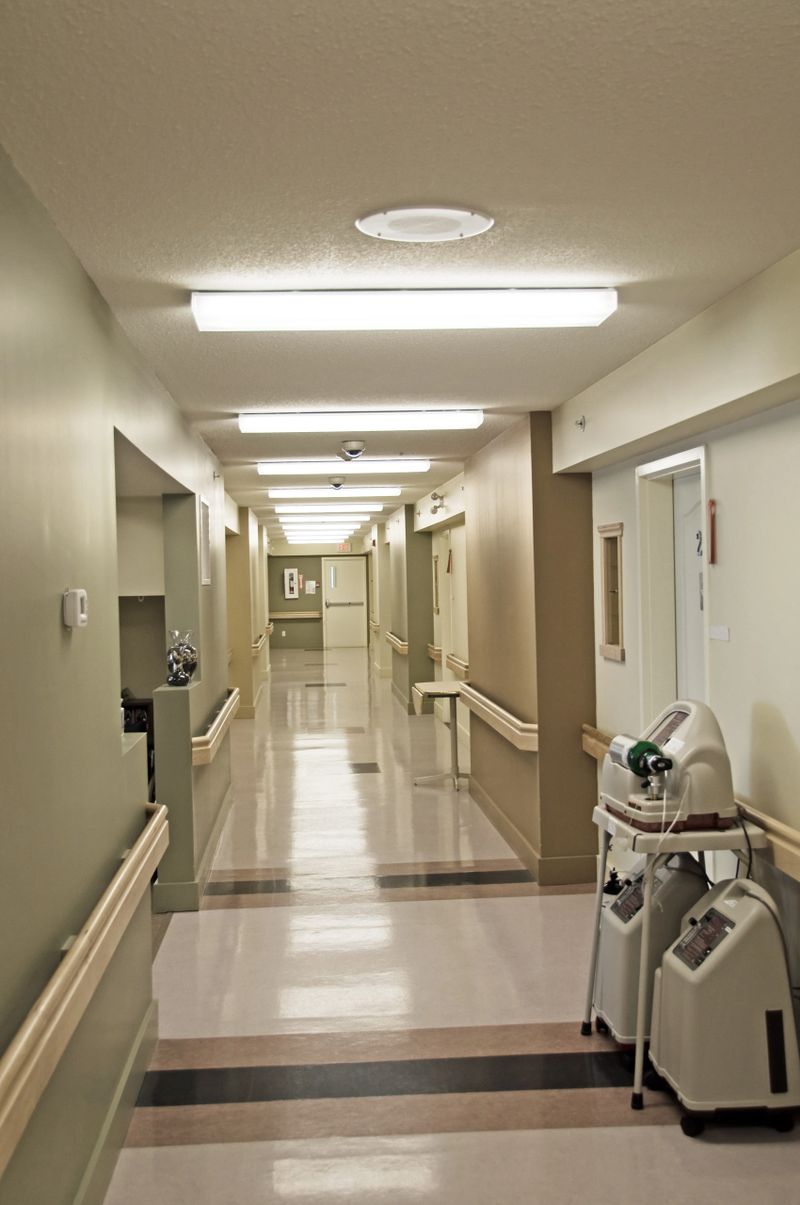 Looking down a senior's residence hall with a oxygen producing machine used by one of the residents.