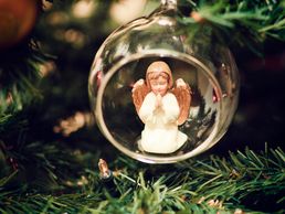 Angel ornament on pine tree