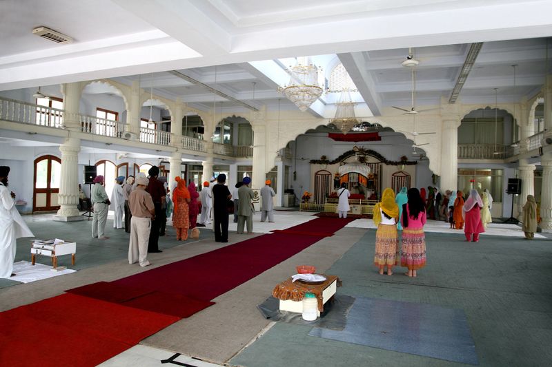 "People praying in a Sikh temple in Ahmedabad, India"