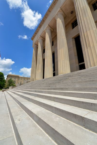 Courthouse facade with columns and sculptures