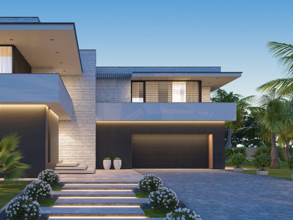 Modern two-story house with sleek design and illuminated steps.