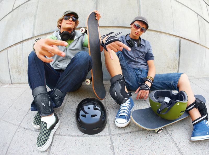 Two male friends with skateboards