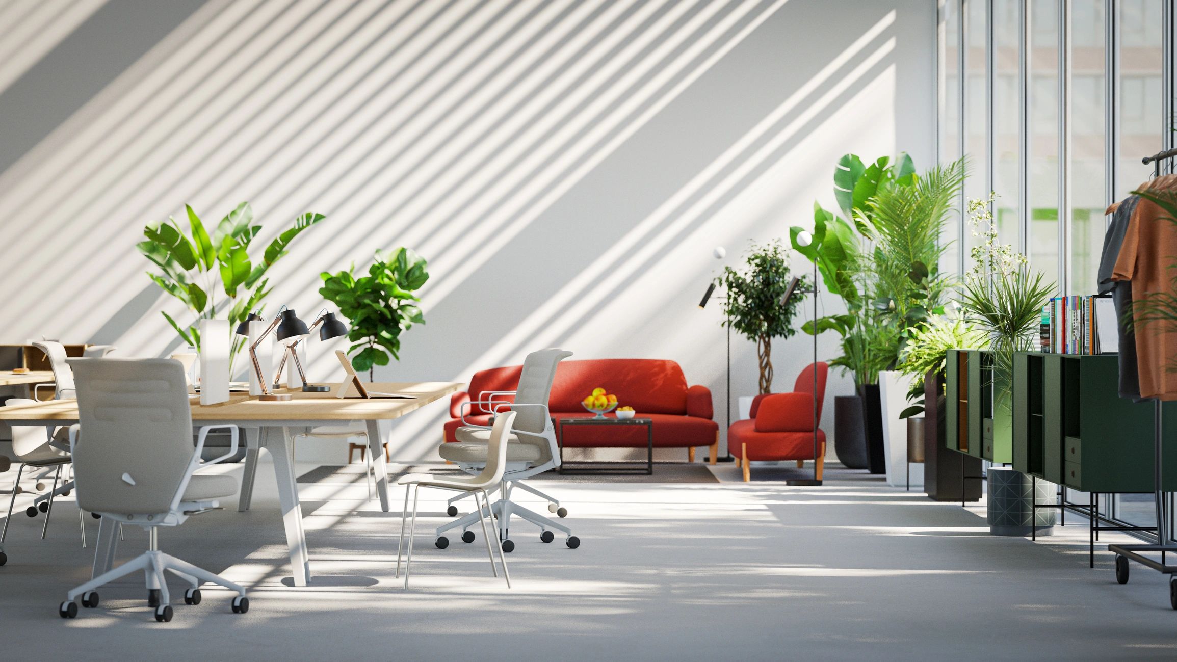 Bright modern office with plants, white chairs, and red lounge seating.