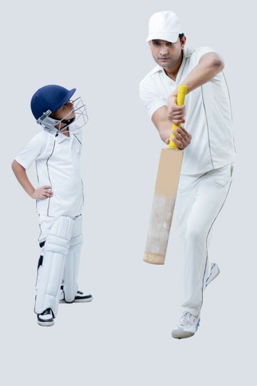 Cricket coach teaching a young player batting techniques.