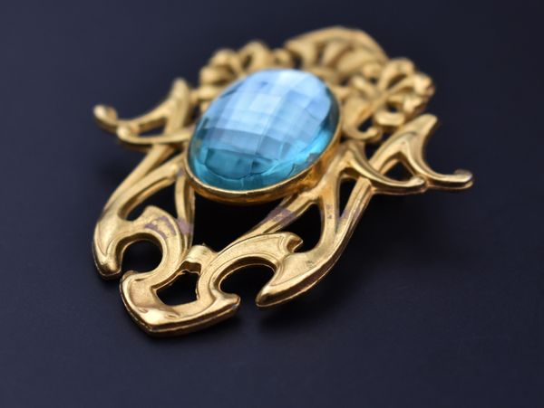 Old vintage brooch on black background, accent retro jewelry for women