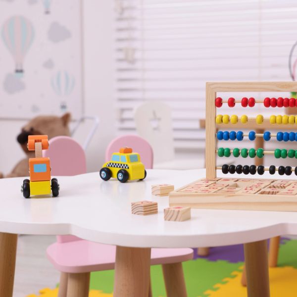 Kids' table with toys and abacus.