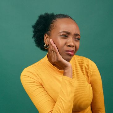 Dental professional performing a root canal treatment to relieve tooth pain and infection.