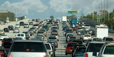 Image of a highway with bumper to bumper traffic 