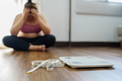 woman who is frustated with weight loss journey