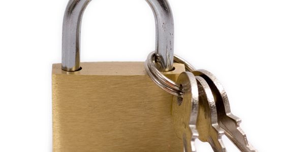 Brass padlock with a set of keys attached by a keyring.