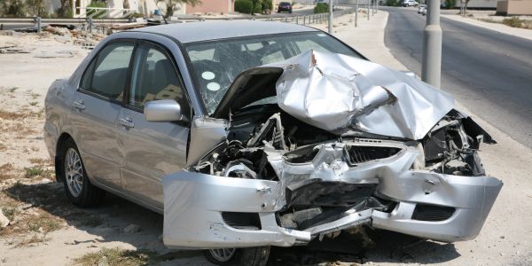Car with severe front-end damage after a crash.