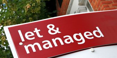 Red sign with white text reading 'let & managed' against a leafy and brick background.