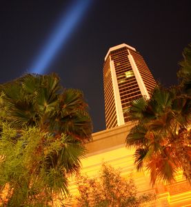A lease sign with a red 'LEASED' sticker across it on a glass door.