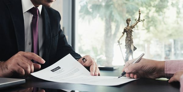 Signing on legal documents.