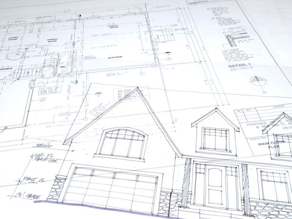 Architectural blueprint with house front elevation and floor plan details.