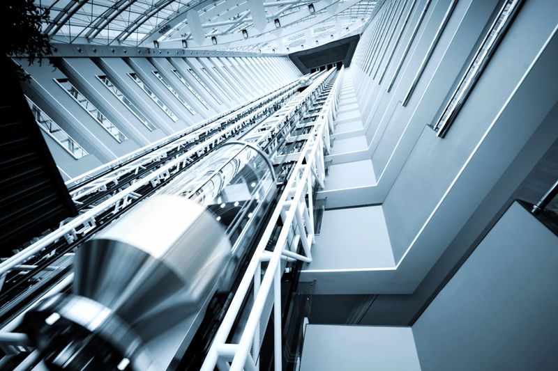 "modern elevator in a futuristic building, blue toned"