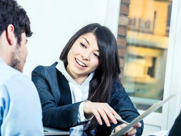 A woman communicating with a man