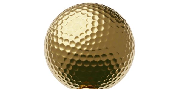 A shiny golden golf ball with detailed dimples.