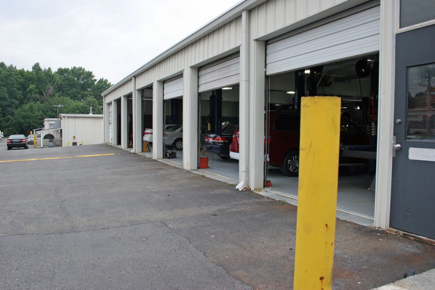 generate an image of a car dealership with antique cars


