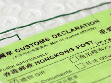 Close-up of a green customs declaration form from Hong Kong Post.