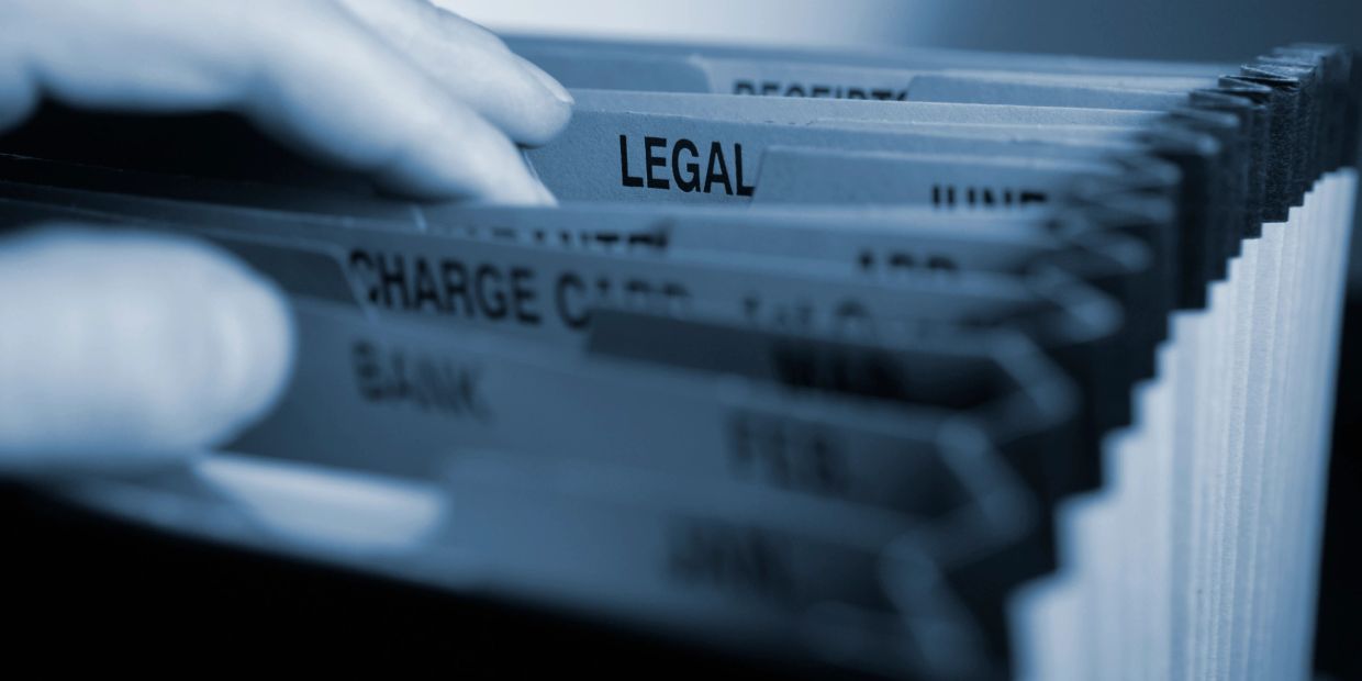 Files and papers on legal estate matters.