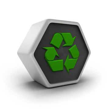 3D green recycling symbol on a hexagonal black and white block.