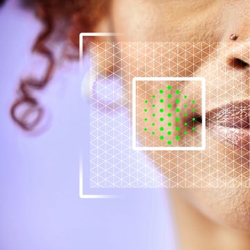 Close-up of facial skin analysis with digital overlay on a woman's face.