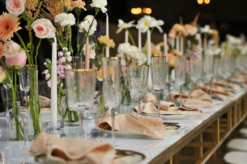 beautiful elegant decor of flowers and elegant serving on the wedding table. Modern wedding decoration