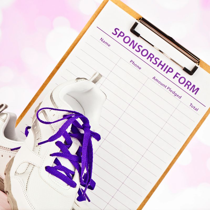 Sponsorship form and tennis shoes with purple laces to promote sponsored run or walk for Alzheimer's research.