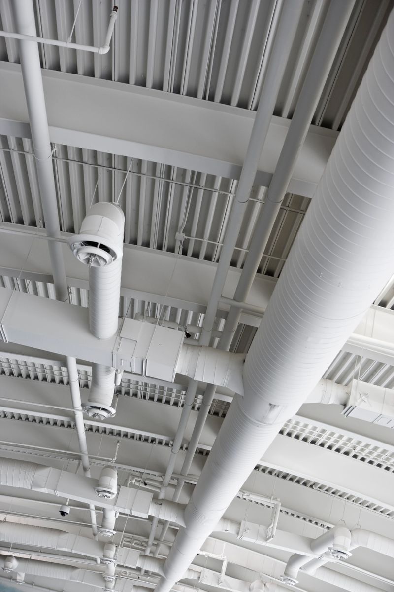 Heating and air pipes on an office cieling
