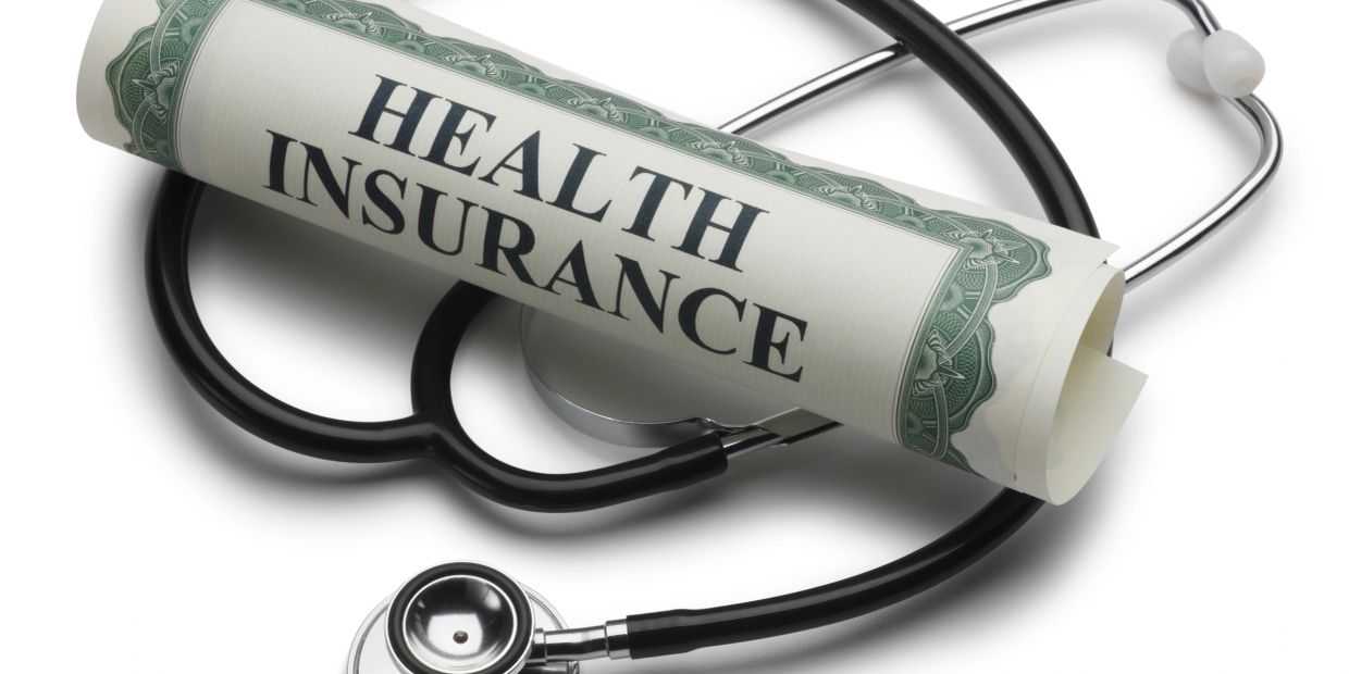 Health insurance document and stethoscope.